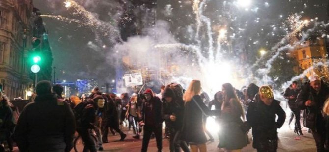 İngiltere’de V for Vendetta maskeli protestocularla polis arasında çatışma